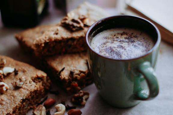 Coffee surrounded by cake