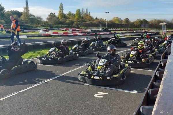 Decorative image showing karts ready to race