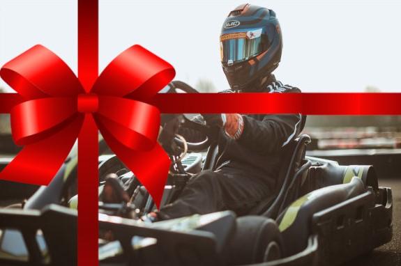 An image of a person karting with a Christmas bow over the top